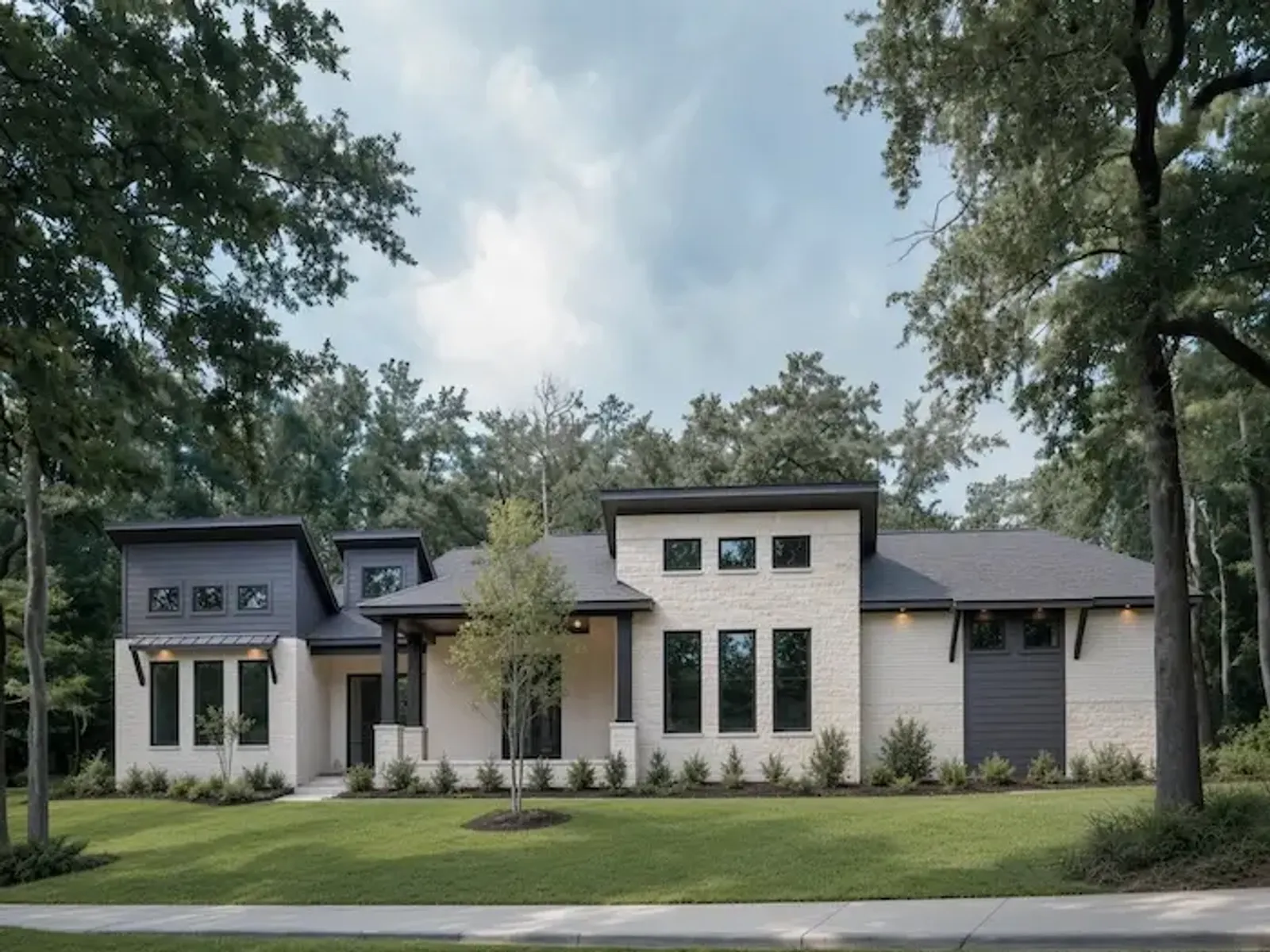 Custom home at dusk with interior lights on