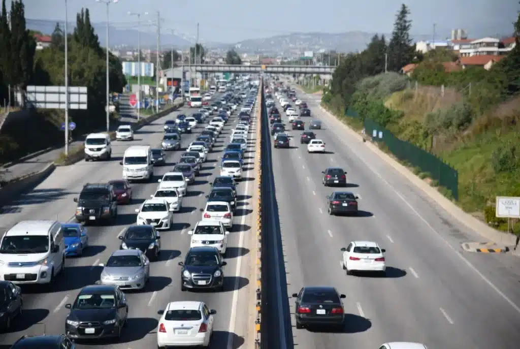 Traffic on a highway, with less traffic on one side.