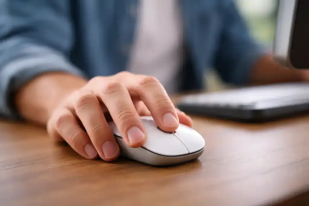A user clicking a mouse.