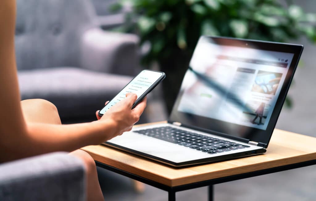 A business owner checks mobile responsiveness on multiple devices